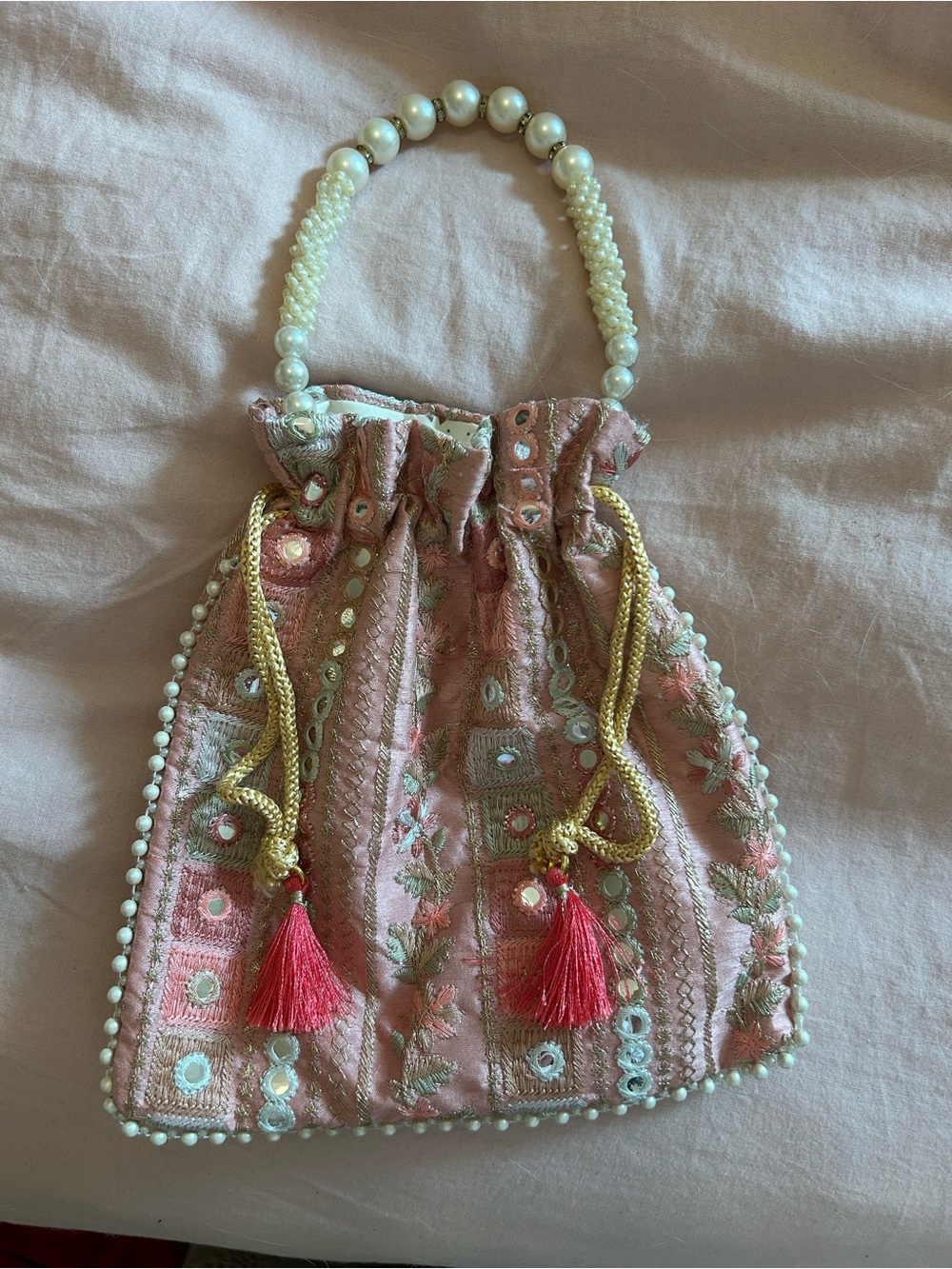 Embroidered Pink Tassel Drawstring Beaded Handle Bag with pearl detail